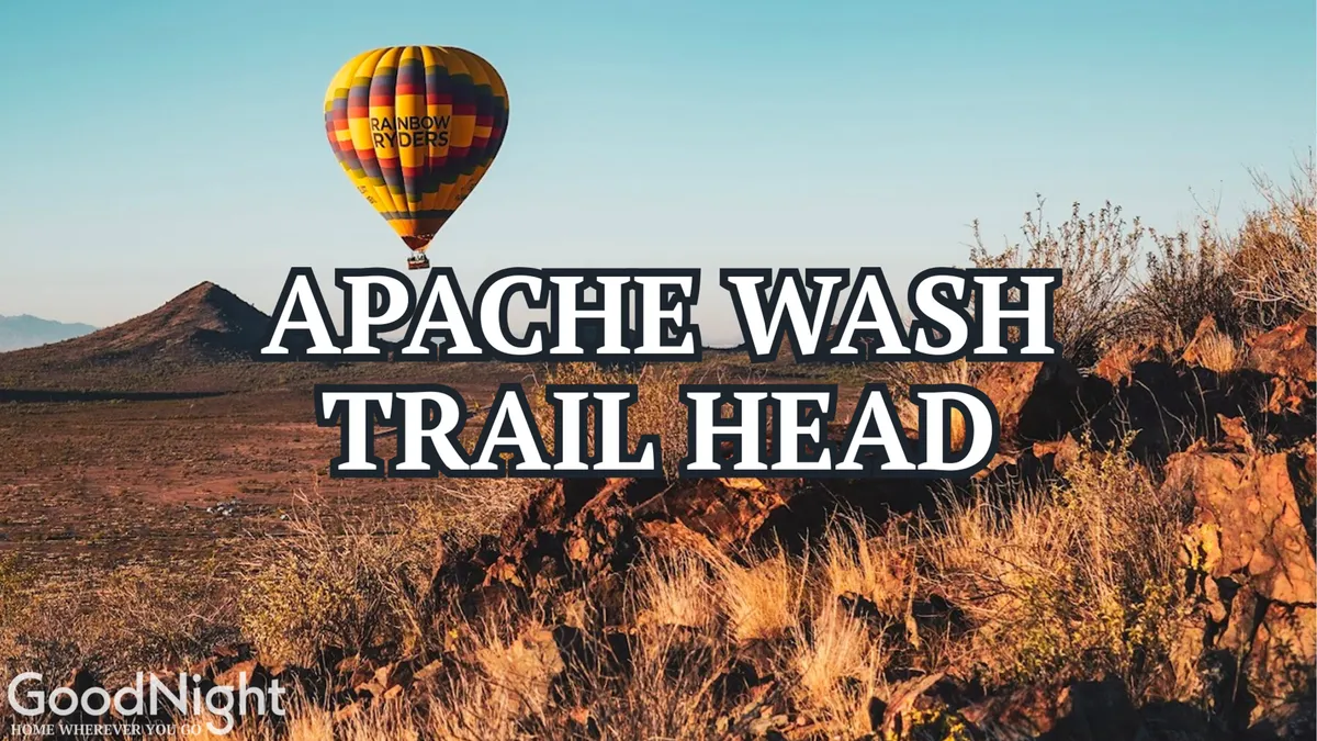 A breathtaking exterior view of a hot air balloon sailing above a rugged desert landscape, with mountains in the background. The expansive sky and natural terrain hint at endless outdoor adventure opportunities nearby.